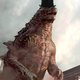 This monster is red and wears a hat, so it's clearly not Godzilla.